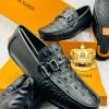 Louis Vuitton crocodile-pattern loafer.
